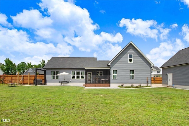 282 Brodie Rose Landing Way, Smithfield, NC 27577 - back of house with a sunroom, a patio area, and a shingled roof