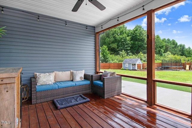 282 Brodie Rose Landing Way, Smithfield, NC 27577 - deck featuring outdoor lounge area, ceiling fan, a fenced backyard, a shed, and view of scattered trees
