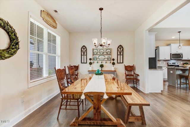 282 Brodie Rose Landing Way, Smithfield, NC 27577 - dining room featuring dark wood-style floors and a chandelier