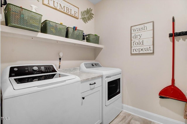 282 Brodie Rose Landing Way, Smithfield, NC 27577 - laundry room with washing machine and dryer, cabinet space, and light wood-style floors