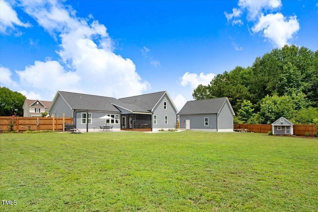 282 Brodie Rose Landing Way, Smithfield, NC 27577 - rear view of property featuring a sunroom, a patio, a fenced backyard, and a storage shed