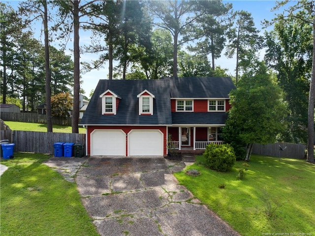 1612 Hennessy Pl, Fayetteville, NC 28303 - view of front of home with covered porch, driveway, and a garage