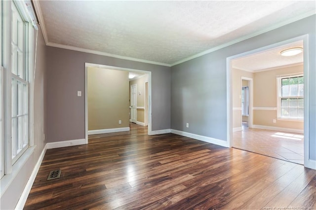 1612 Hennessy Pl, Fayetteville, NC 28303 - spare room with wood finished floors, a textured ceiling, and ornamental molding