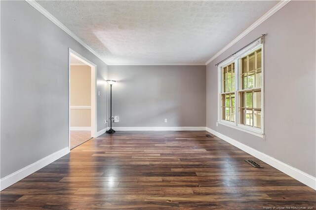 1612 Hennessy Pl, Fayetteville, NC 28303 - spare room with a textured ceiling, dark wood-style flooring, and crown molding