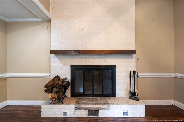 1612 Hennessy Pl, Fayetteville, NC 28303 - detailed view of wood finished floors, a fireplace, and ornamental molding