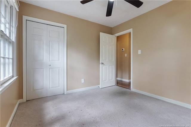 1612 Hennessy Pl, Fayetteville, NC 28303 - unfurnished bedroom featuring carpet floors, a closet, and multiple windows
