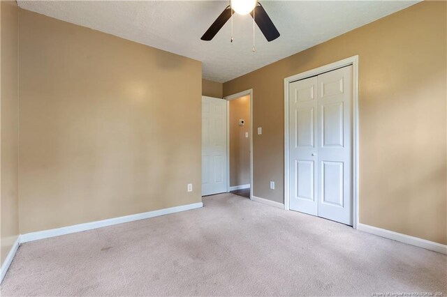 1612 Hennessy Pl, Fayetteville, NC 28303 - unfurnished bedroom with carpet flooring, a closet, and a ceiling fan