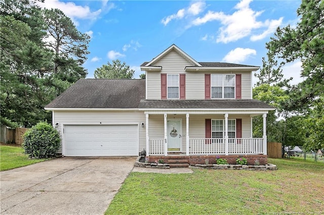 69 Ribbon Oak Ct, Sanford, NC 27332 - traditional-style home with covered porch, concrete driveway, a garage, and a shingled roof