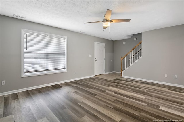 69 Ribbon Oak Ct, Sanford, NC 27332 - unfurnished living room with a ceiling fan, stairway, and wood finished floors