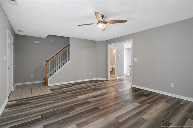69 Ribbon Oak Ct, Sanford, NC 27332 - unfurnished room with a ceiling fan, stairs, and wood finished floors