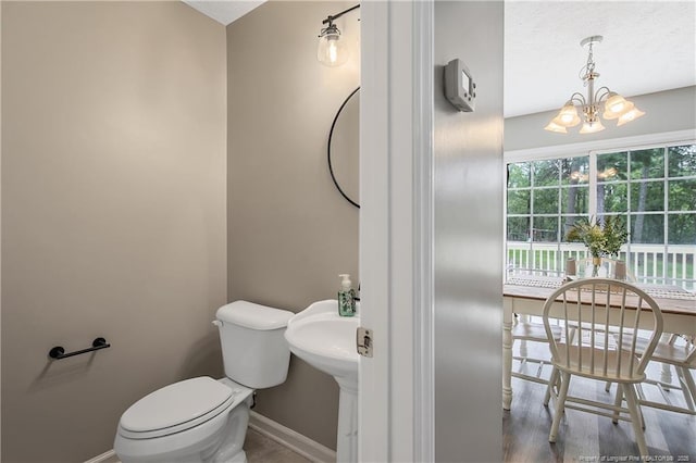 69 Ribbon Oak Ct, Sanford, NC 27332 - half bathroom featuring baseboards and a chandelier