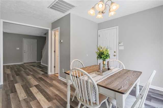 69 Ribbon Oak Ct, Sanford, NC 27332 - dining area featuring a chandelier, wood finished floors, and stairs