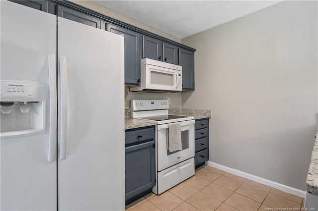 69 Ribbon Oak Ct, Sanford, NC 27332 - kitchen with white appliances, light countertops, and light tile patterned flooring