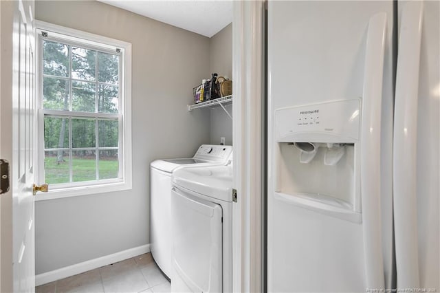 69 Ribbon Oak Ct, Sanford, NC 27332 - laundry area featuring washing machine and clothes dryer and light tile patterned flooring