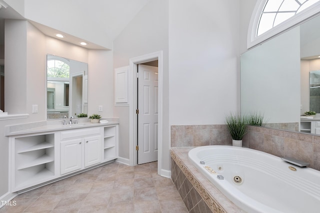 500 Walcott Way, Cary, NC 27519 - bathroom featuring a jetted tub, vanity, high vaulted ceiling, and recessed lighting