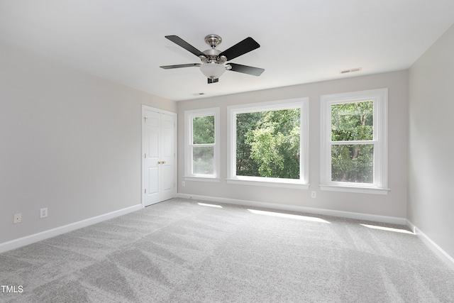 500 Walcott Way, Cary, NC 27519 - carpeted spare room with baseboards and a ceiling fan