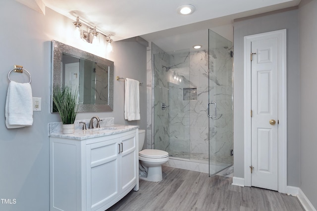500 Walcott Way, Cary, NC 27519 - full bathroom featuring a marble finish shower, vanity, wood finished floors, and recessed lighting