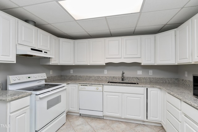 500 Walcott Way, Cary, NC 27519 - kitchen with white appliances, under cabinet range hood, a drop ceiling, white cabinetry, and light tile patterned floors