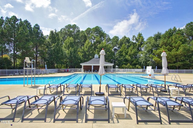 500 Walcott Way, Cary, NC 27519 - community pool featuring a patio and view of wooded area