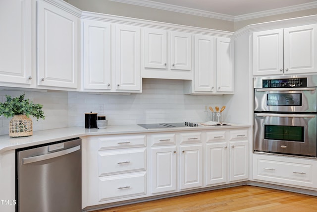 500 Walcott Way, Cary, NC 27519 - kitchen with stainless steel appliances, white cabinetry, and ornamental molding