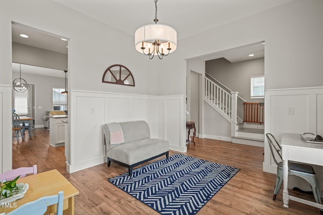 1006 Whistler St, Durham, NC 27713 - office space with a chandelier, a decorative wall, a wainscoted wall, and wood finished floors
