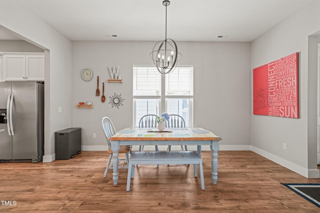 1006 Whistler St, Durham, NC 27713 - dining space with a chandelier and light wood-style floors