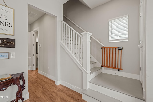 1006 Whistler St, Durham, NC 27713 - stairway featuring wood finished floors and baseboards