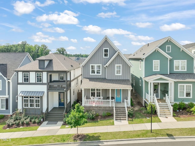 1006 Whistler St, Durham, NC 27713 - view of front of home featuring board and batten siding, covered porch, a shingled roof, and a residential view