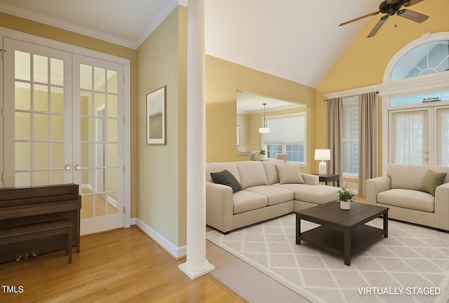 1016 Pasture View Ln, Raleigh, NC 27603 - living area with french doors, light wood finished floors, ceiling fan, ornamental molding, and lofted ceiling