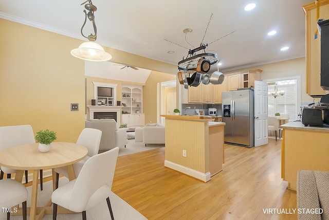 1016 Pasture View Ln, Raleigh, NC 27603 - kitchen featuring stainless steel refrigerator with ice dispenser, crown molding, light brown cabinetry, light wood-style floors, and recessed lighting