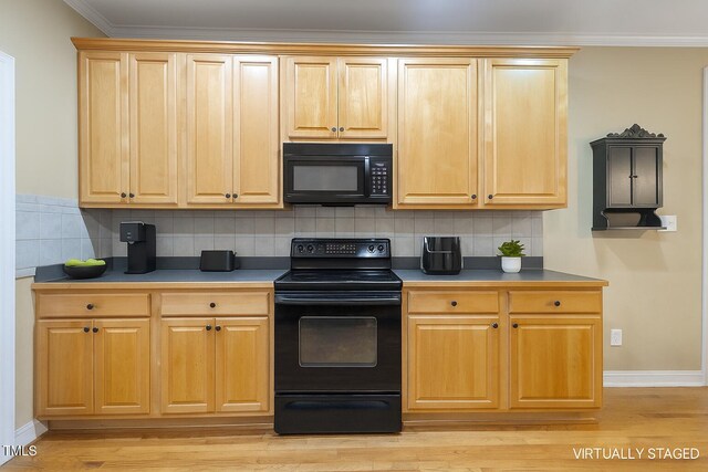 1016 Pasture View Ln, Raleigh, NC 27603 - kitchen with black appliances, light wood finished floors, crown molding, and tasteful backsplash