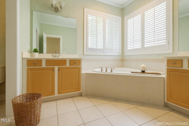 1016 Pasture View Ln, Raleigh, NC 27603 - bathroom with a garden tub, tile patterned floors, vanity, and ornamental molding