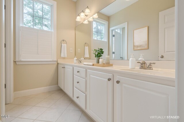 1016 Pasture View Ln, Raleigh, NC 27603 - bathroom featuring double vanity and tile patterned flooring