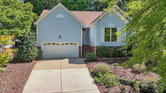 125 Chimney Rise Dr, Cary, NC 27511 - view of front of property featuring driveway and roof with shingles