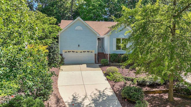 125 Chimney Rise Dr, Cary, NC 27511 - traditional home featuring concrete driveway and a garage