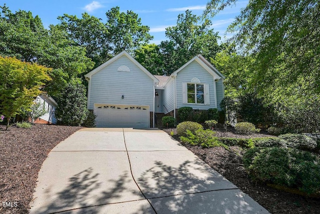 125 Chimney Rise Dr, Cary, NC 27511 - traditional home with driveway and an attached garage