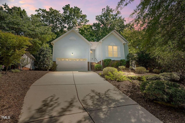 125 Chimney Rise Dr, Cary, NC 27511 - traditional home with concrete driveway and an attached garage