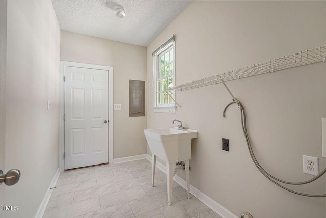 125 Chimney Rise Dr, Cary, NC 27511 - laundry area featuring a textured ceiling, electric dryer hookup, and electric panel