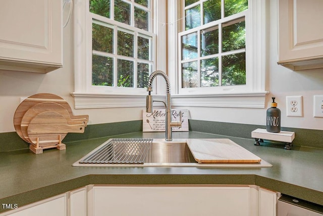 125 Chimney Rise Dr, Cary, NC 27511 - kitchen view of dark countertops and white cabinets