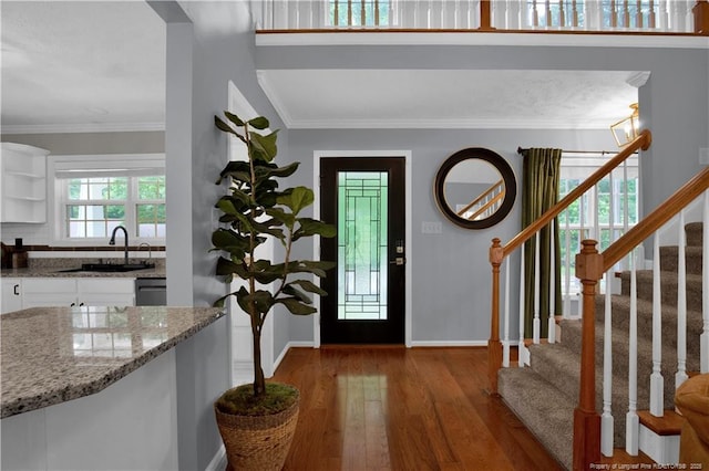 4010 Arcadia Ct, Fayetteville, NC 28311 - foyer entrance with wood finished floors, stairs, and crown molding