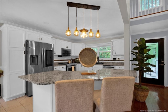 4010 Arcadia Ct, Fayetteville, NC 28311 - kitchen featuring stainless steel appliances, crown molding, white cabinetry, decorative backsplash, and light stone countertops