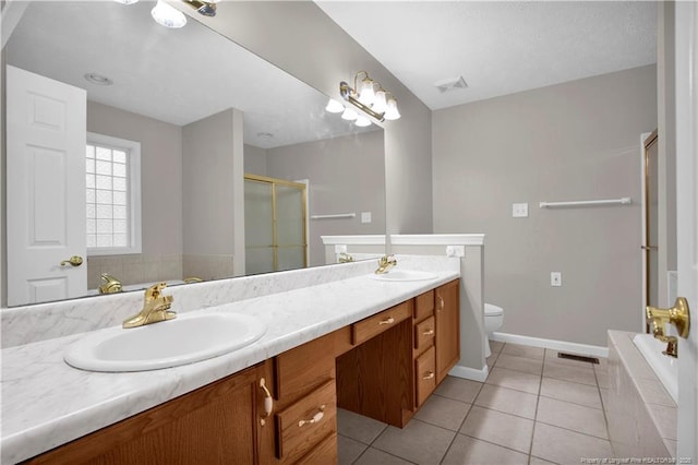 4010 Arcadia Ct, Fayetteville, NC 28311 - bathroom with double vanity, a stall shower, a bath, and tile patterned floors