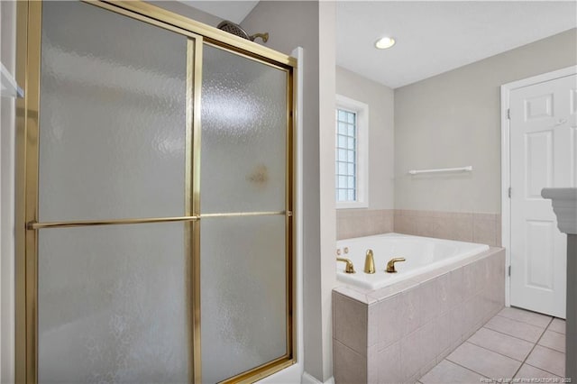 4010 Arcadia Ct, Fayetteville, NC 28311 - bathroom featuring a bath, a shower stall, and tile patterned floors