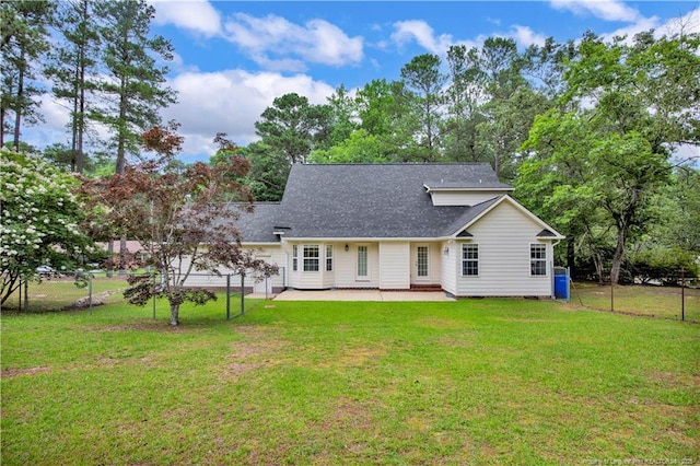 4010 Arcadia Ct, Fayetteville, NC 28311 - back of house with a patio area, a shingled roof, and view of wooded area