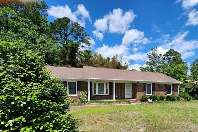 1519 Palmer Dr, Fayetteville, NC 28303 - single story home with a front lawn, brick siding, and a porch