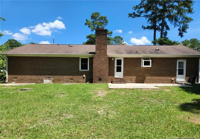 1519 Palmer Dr, Fayetteville, NC 28303 - rear view of property with entry steps, crawl space, a chimney, a patio, and brick siding