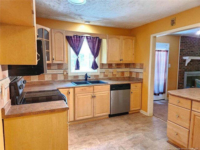 1519 Palmer Dr, Fayetteville, NC 28303 - kitchen featuring dishwasher, light brown cabinets, and a textured ceiling