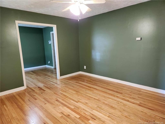 1519 Palmer Dr, Fayetteville, NC 28303 - unfurnished room with light wood finished floors, ceiling fan, and a textured ceiling