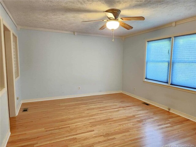1519 Palmer Dr, Fayetteville, NC 28303 - empty room featuring light wood-type flooring, a textured ceiling, ornamental molding, and ceiling fan