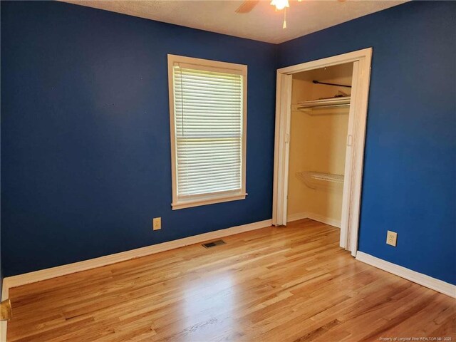 1519 Palmer Dr, Fayetteville, NC 28303 - unfurnished bedroom with wood finished floors, a closet, and ceiling fan